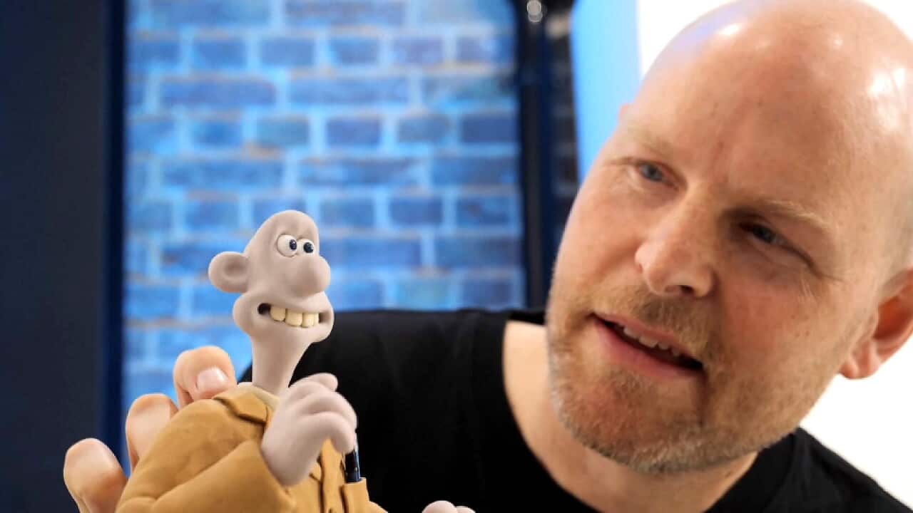 Animator Will Becher with the unique Wallace pupper (AP).jpg
