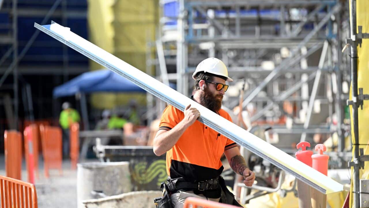 A worker is seen at a new housing building development in Brisbane