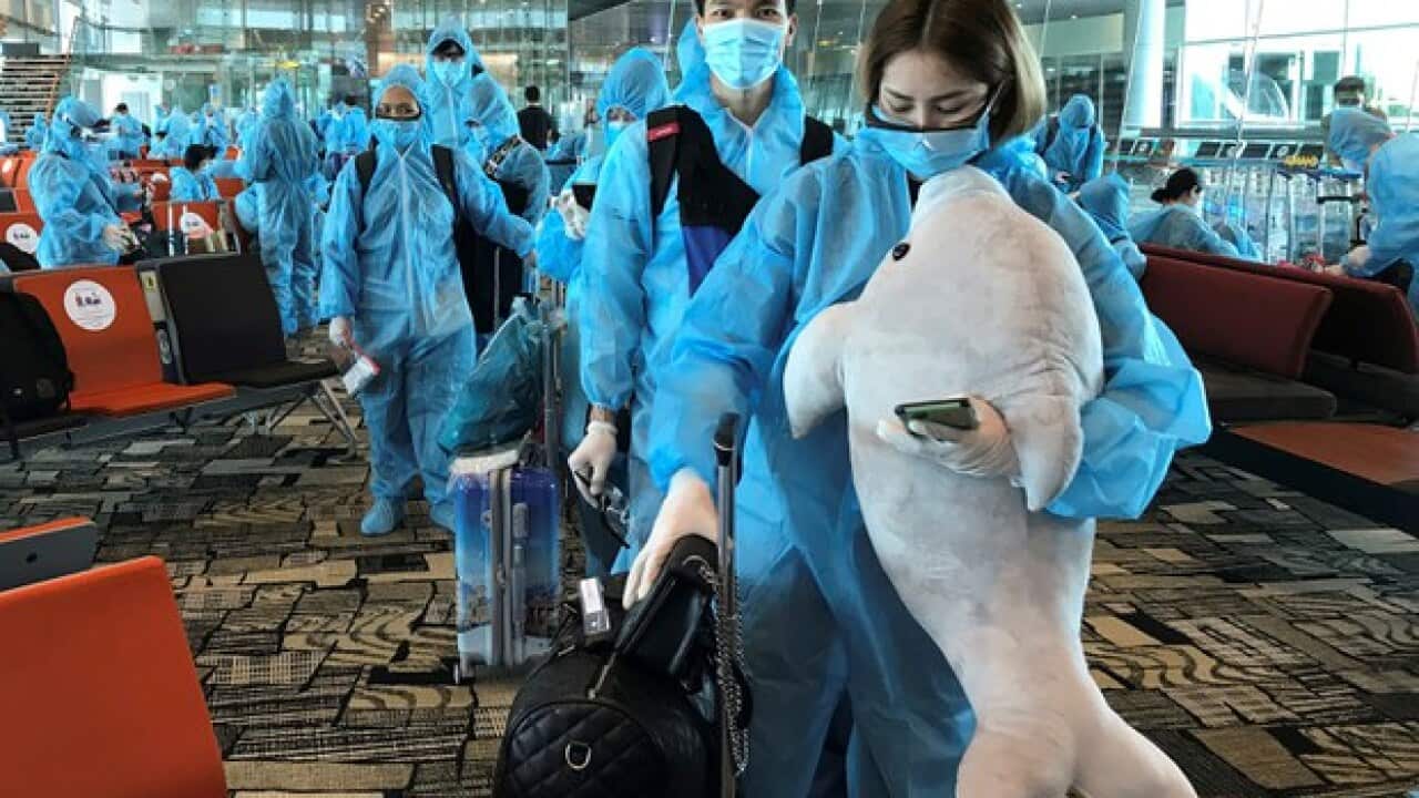Passengers boarding a repatriation flight from Singapore to Vietnam at Changi airport, Singapore, Aug 7, 2020. Reuterts.jpeg