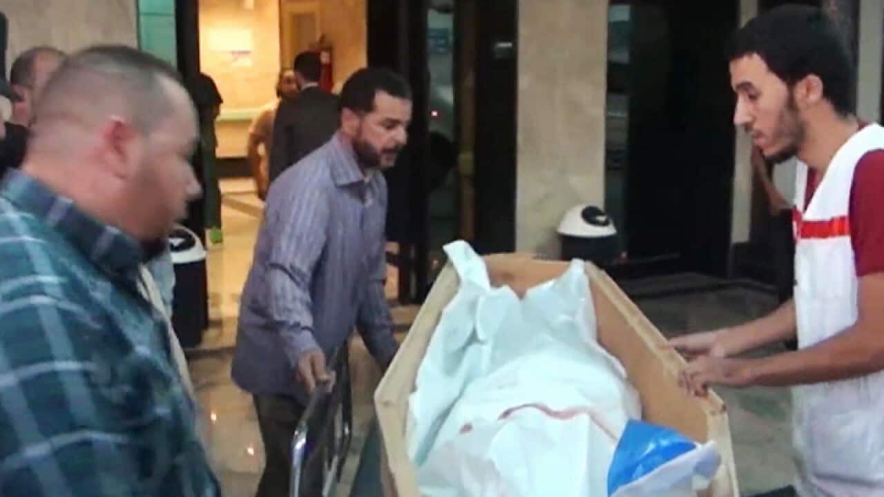 The body of a staff member of the Red Cross who was killed in Libya