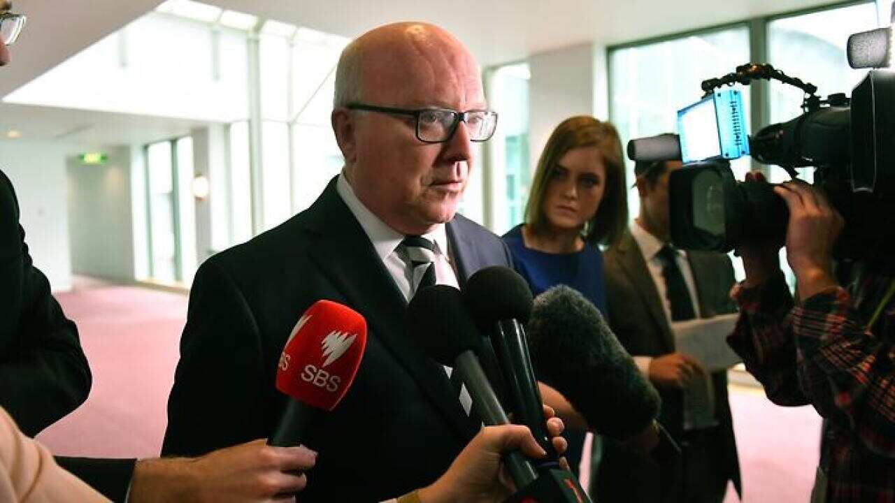 Attorney-General George Brandis speaks to the media at Parliament House in Canberra, Wednesday, August 16, 2017.
