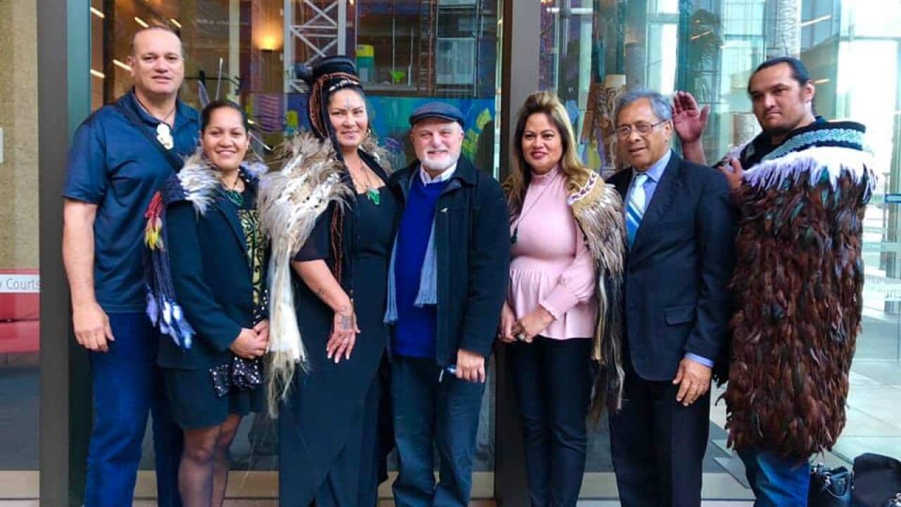 Lady Crown (third from left) lead a group of Rangihou people to the Federal Court on Wednesday.