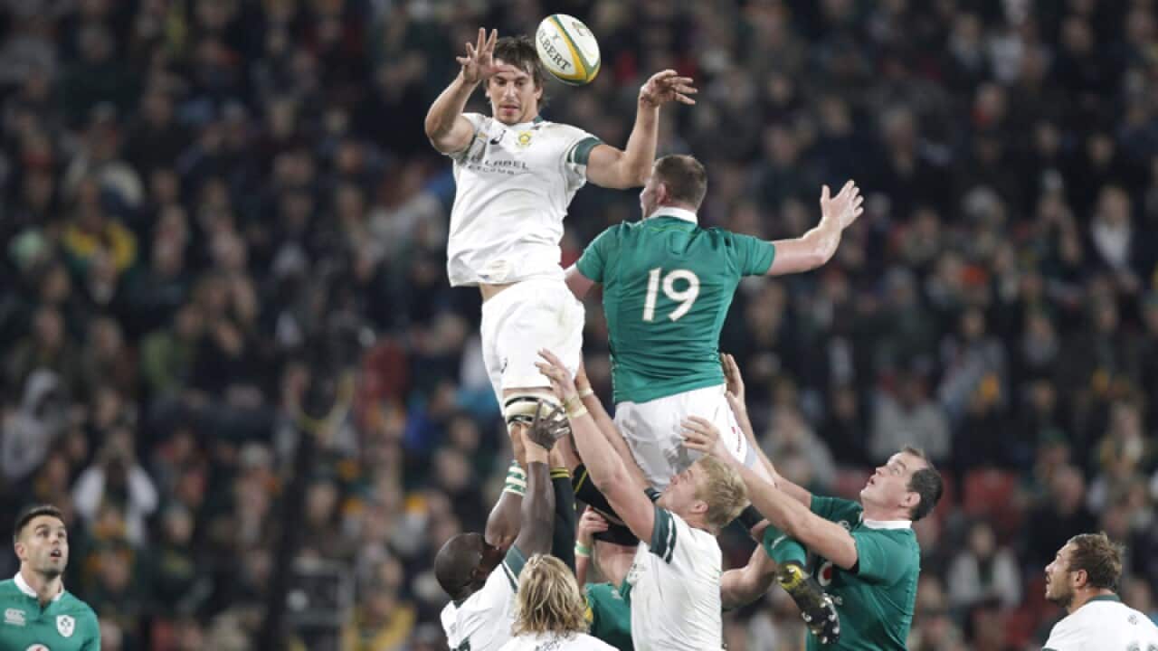South Africa's Eben Etzebeth (L) takes the ball