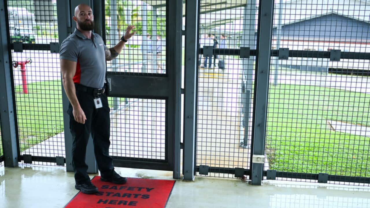 A guard at the North West Point Detention Centre on Christmas Island
