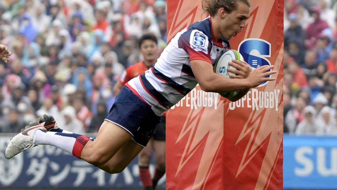 Ben Meehan of Australia's Rebels scores a try