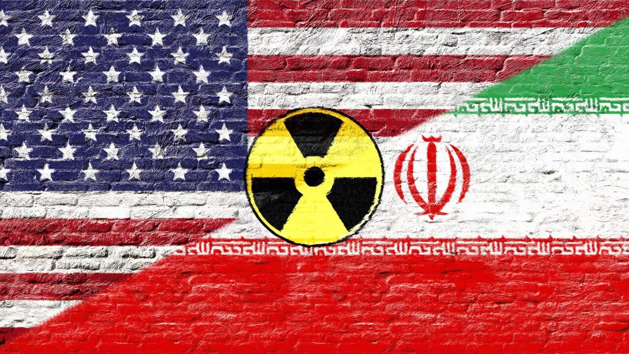 United states and Iran - National flags on Brick wall