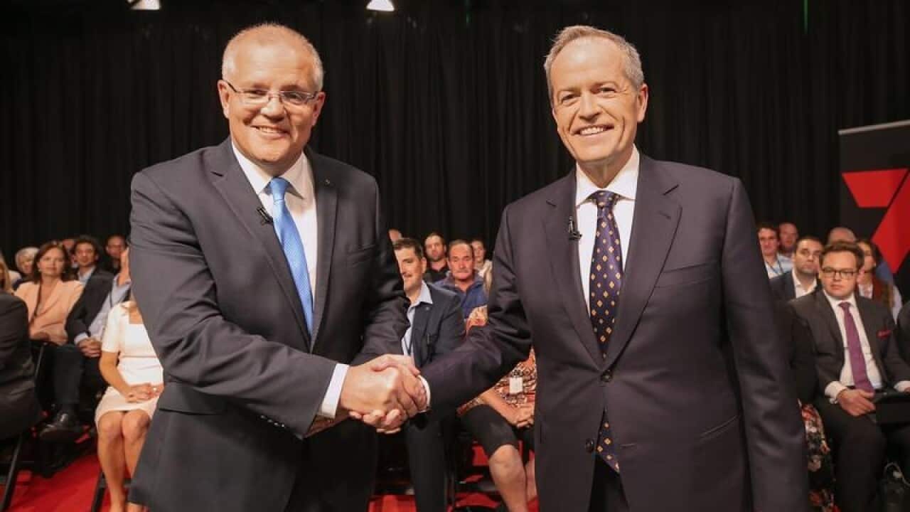 Scott Morrison and Bill Shorten shake hands before their debate.