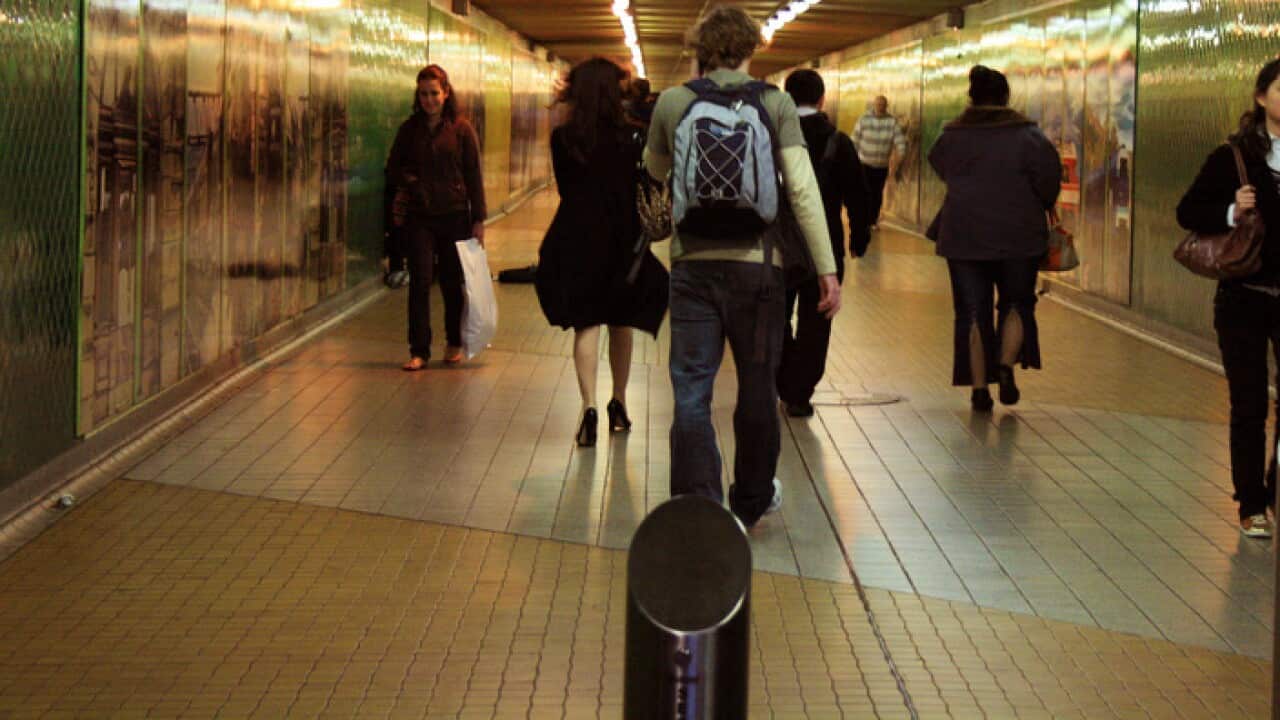 People walking through Central Station railway tunnel in Sydney, June 27, 2008. (AAP Image/Melanie Foster) NO ARCHIVING