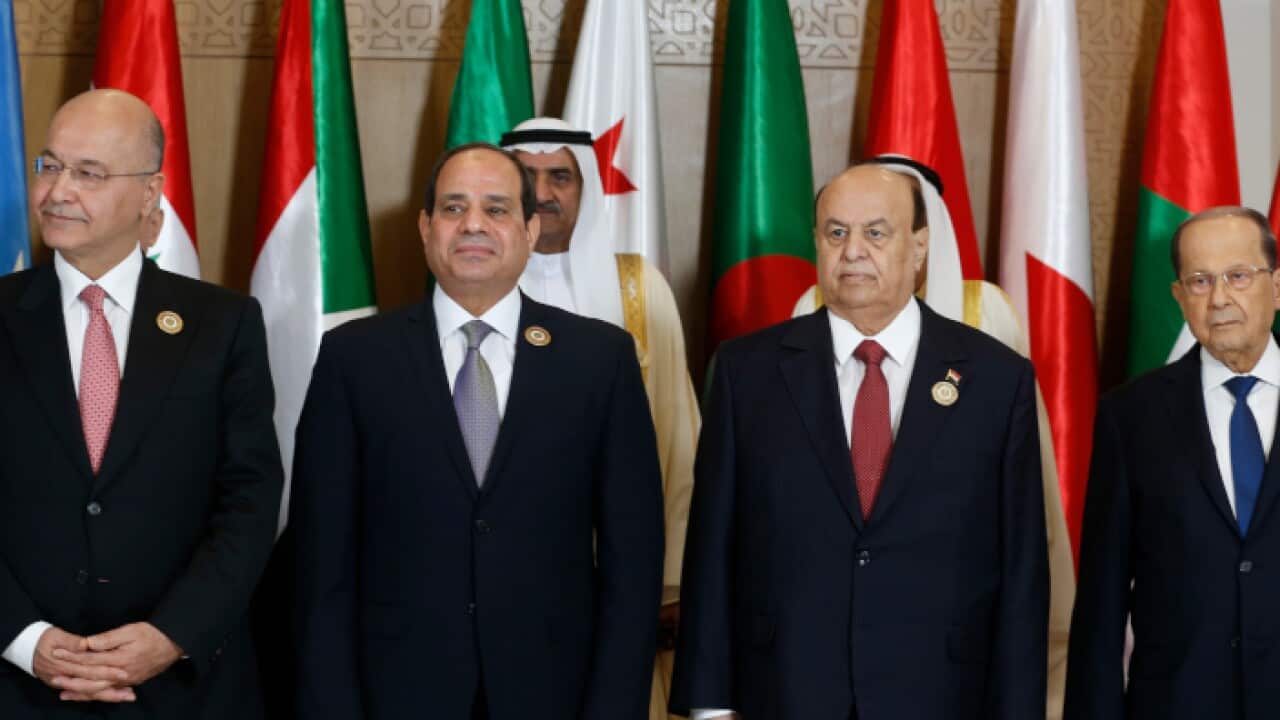 raq's President Barham Salih, Egyptian President Abdel Fattah al-Sisi, Yemeni President Abd-Rabbu Mansour and Lebanese President Michel Aoun pose during the group photo with Arab leaders
