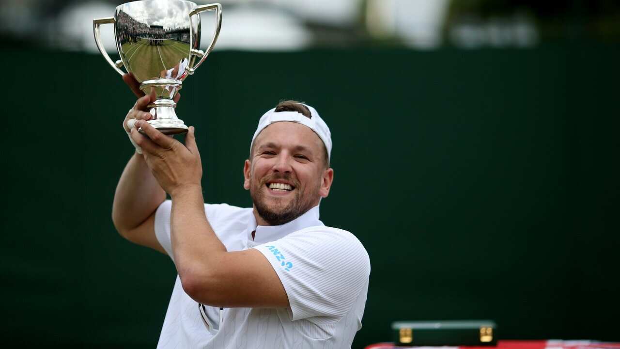 Dylan Alcott celebrates victory in the men's quads wheelchair singles.