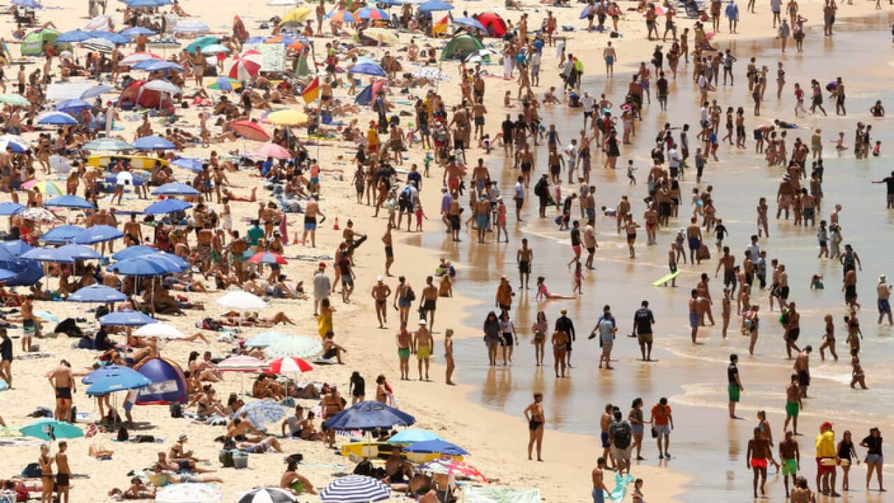 Beachgoers are seen on Bondi beach in Sydney, Sunday, January 7, 2018. The temperatures is set to rise up to 42 degrees on the coast before cooler conditions are expected to reach coastal areas during the afternoon and Sydney's west in the evening. (AAP I
