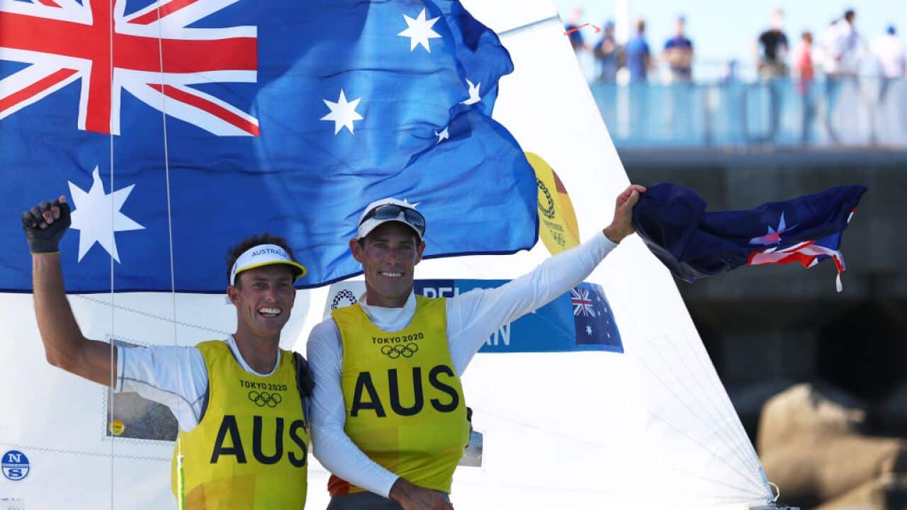 Mathew Belcher and Will Ryan of Team Australia celebrate winning gold in the Men's 470 class on 4 August, 2021.