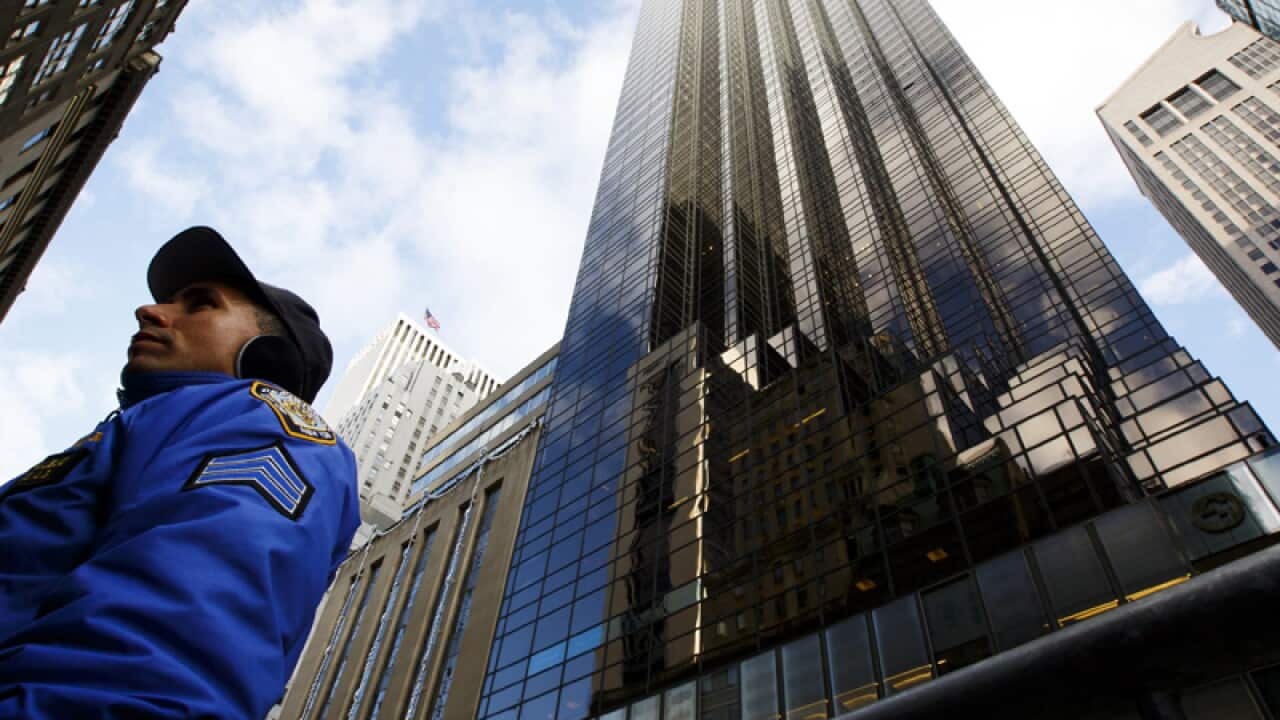 A New York police officer stands in front of Trump Tower in New York