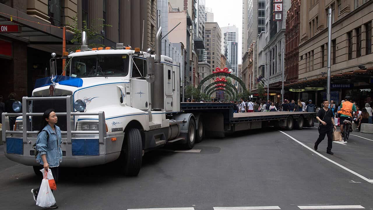 Semi trailers and concrete bollards are used to block streets around Pitt Street Mall, George Street and Elizabeth Streets during the Boxing Day sales.