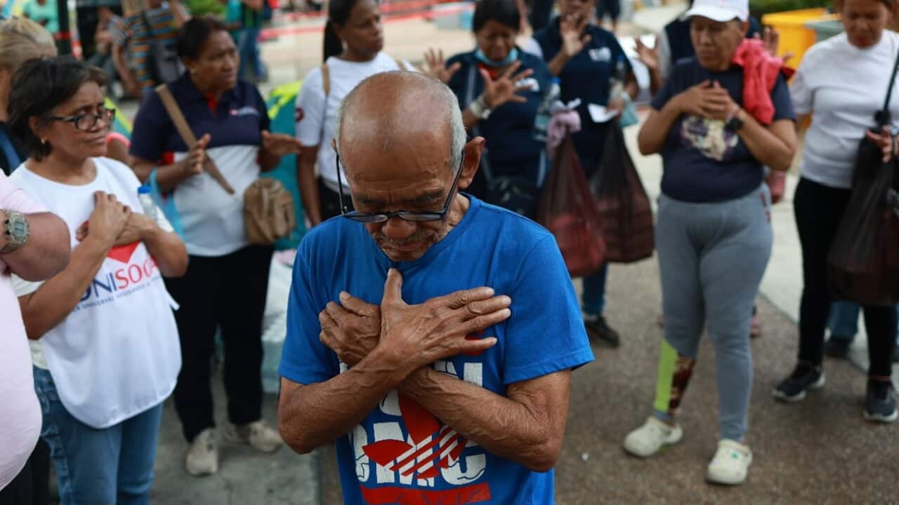 People pray for the victims at an aid collection centre for people affected by the twin earthquakes in Caracas, Venezuela, Saturday, June 27, 2026.jpg