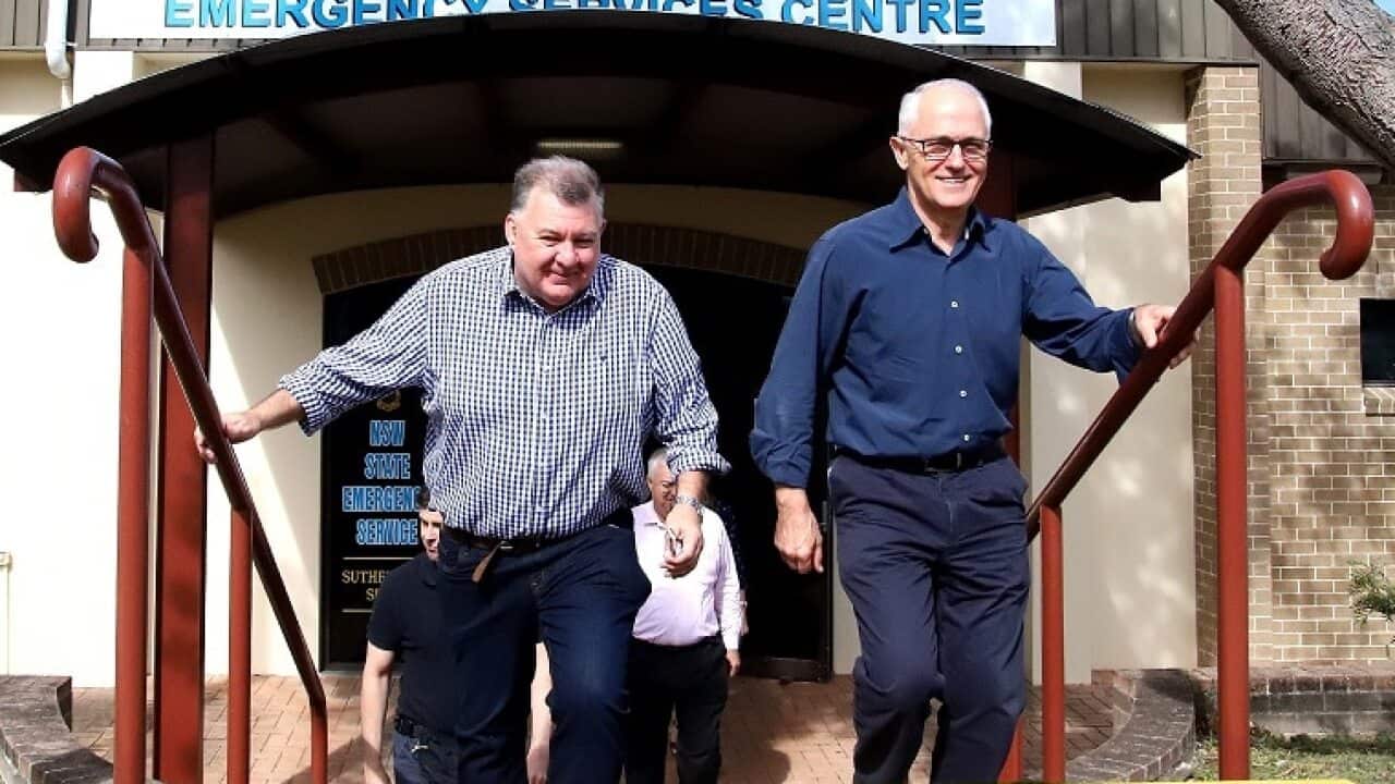Member for Hughes Craig Kelly and Prime Minister Malcolm Turnbull leave after a bushfire briefing and press conference at Heathcote Fire Control Centre in Sydney, Sunday, April 15, 2018. (AAP Image/Jeremy Ng) NO ARCHIVING