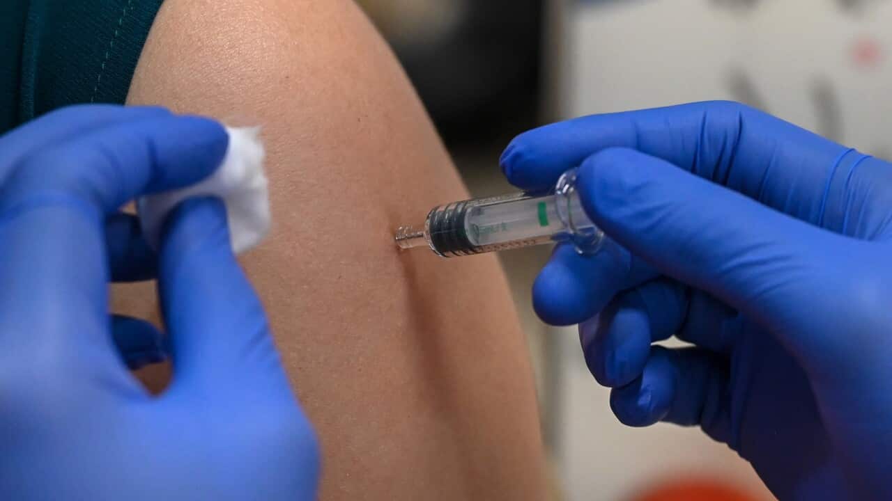 A woman receives a dose of the Sinopharm Covid-19 coronavirus vaccine at the Mount Elizabeth hospital vaccine centre in Singapore on September 7, 2021. (Photo by Roslan Rahman / AFP) (Photo by ROSLAN RAHMAN/AFP via Getty Images)