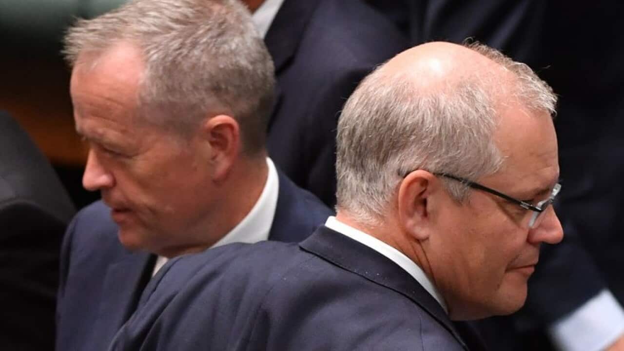 Bill Shorten, left, and Scott Morrison during a division in the House