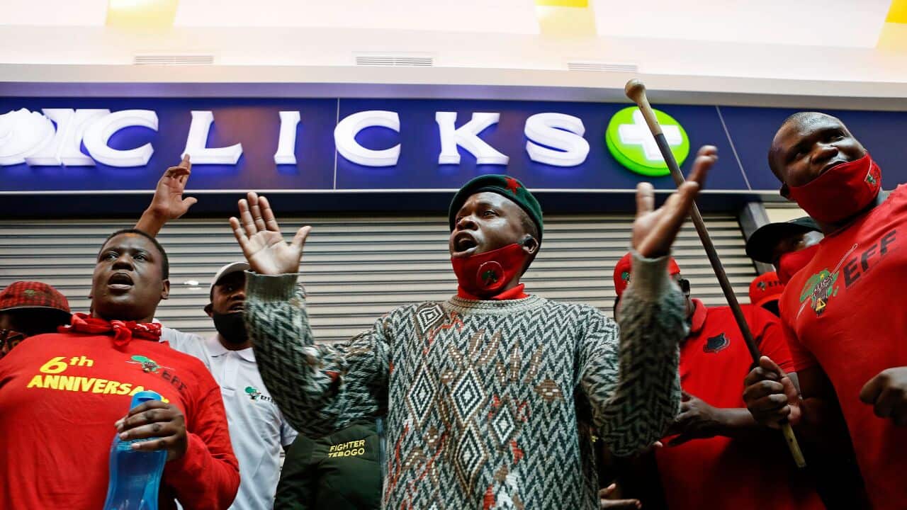 Dozens of South Africa's radical EFF party activists picketed outside stores over a hair advert describing black hair as "dull" and white hair as "normal".