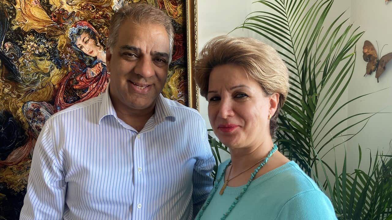 A man and a woman standing next to each other