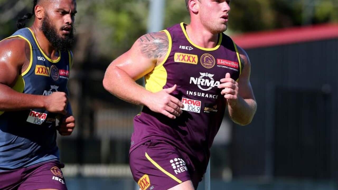 Brisbane Broncos player Matt Lodge (r) and Sales Funaki