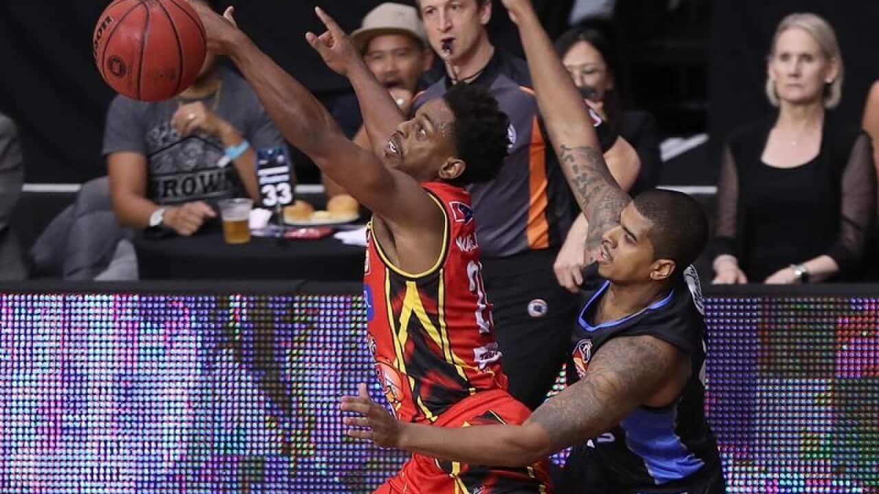Casper Ware of United is challenged by Edgar Sosa of the Breakers.