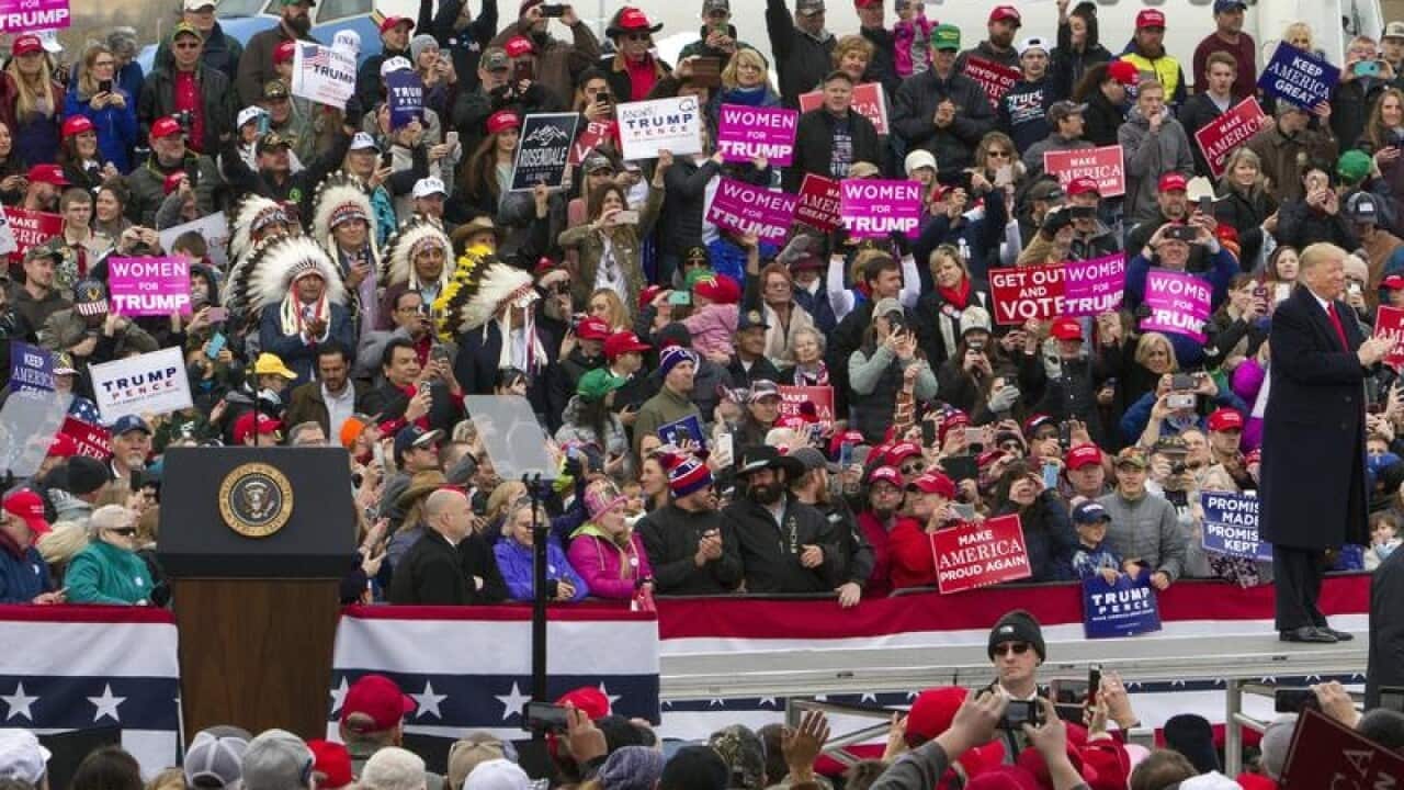 President Donald Trump and supporters at a rally in Belgrade, Montana
