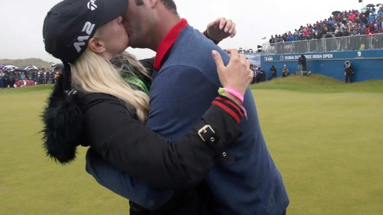 Spain's Jon Rahm kisses girlfriend Kelley Cahill