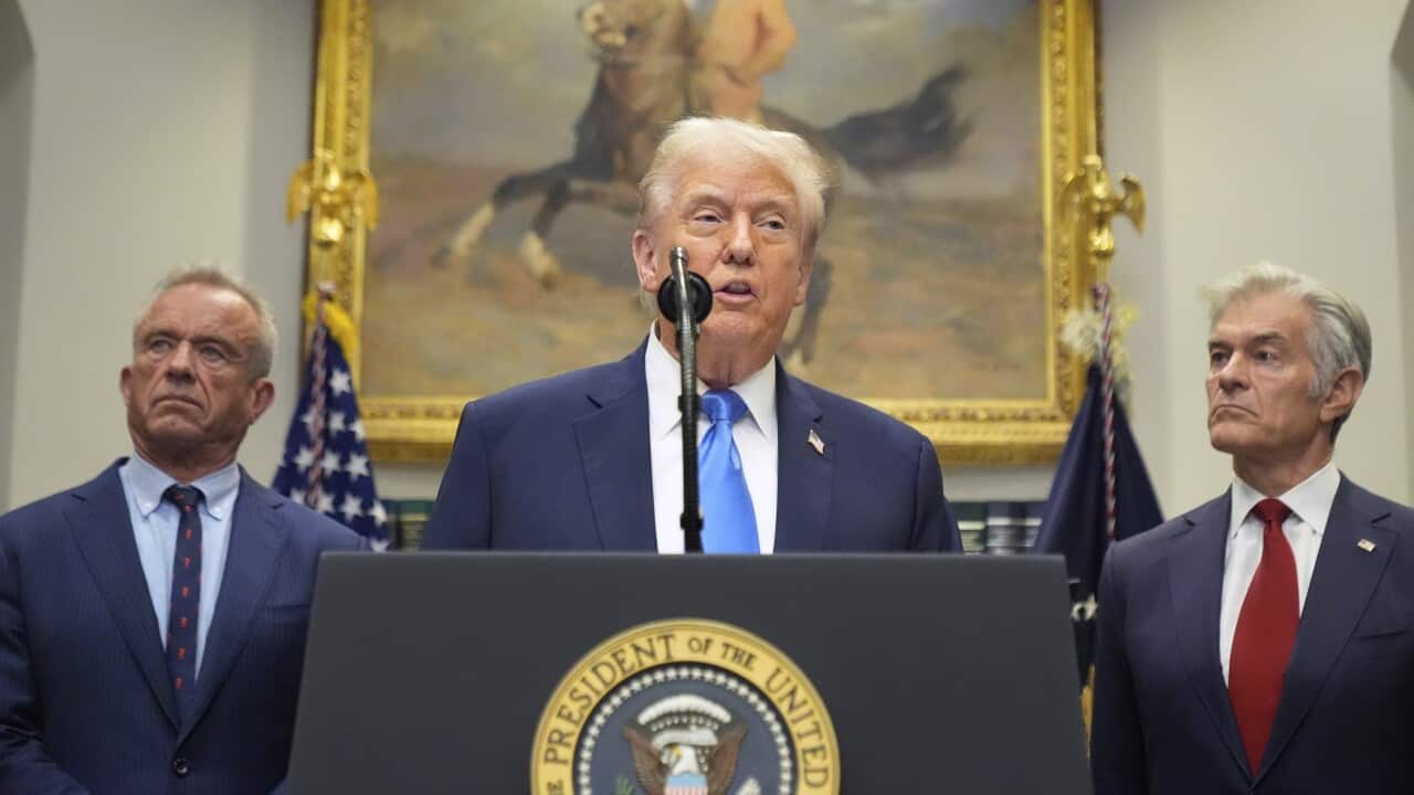 President Donald Trump speaks in the Roosevelt Room of the White House, Monday, Sept. 22, 2025, in Washington, as Health and Human Services Secretary Robert F. Kennedy Jr., left, and Centers for Medicare & Medicaid Services administrator Dr. Mehmet Oz listen