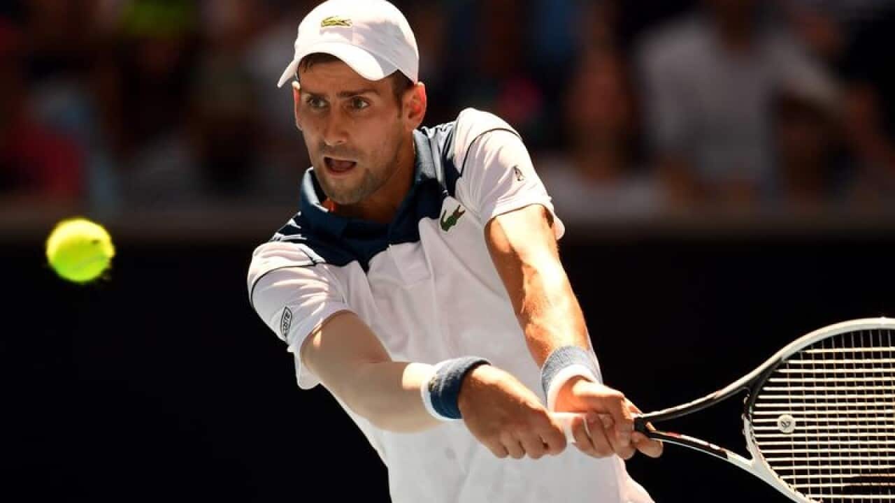 Novak Djokovic of Serbia in action against Donald Young.