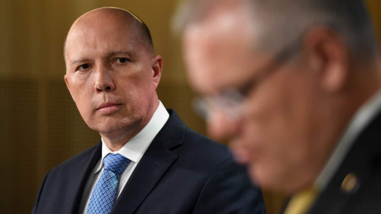 Minister for Home Affairs Peter Dutton (left) and Prime Minister Scott Morrison (AAP)