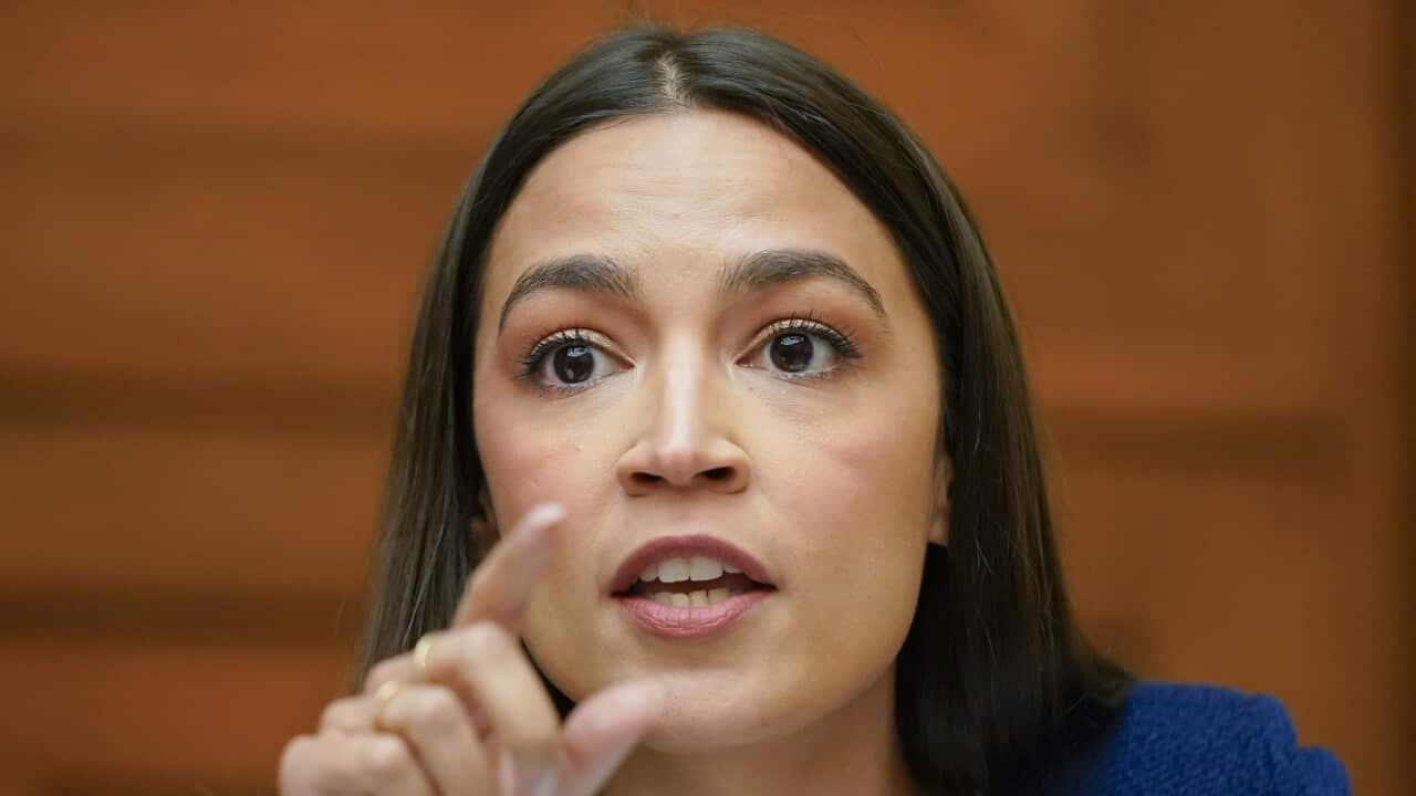 Close-up of Democrat politician Alexandria Ocasio-Cortez seated and speaking