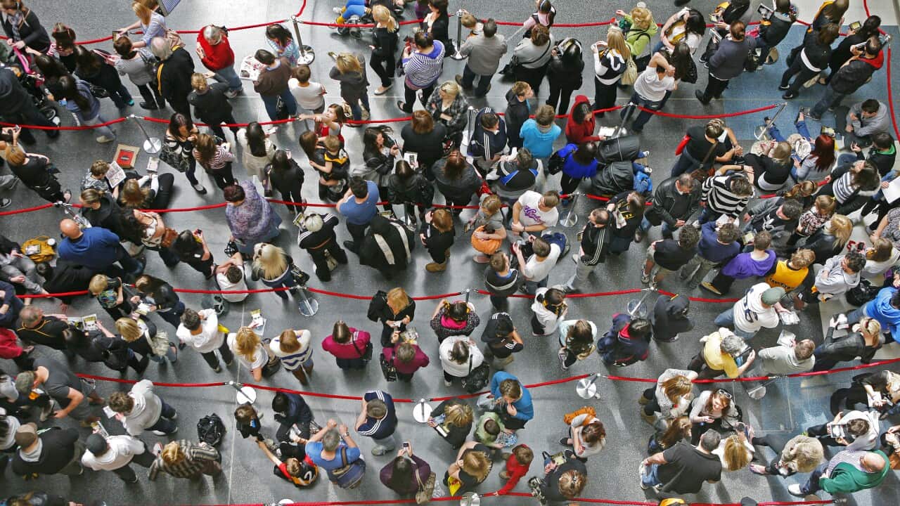 People wait in queues