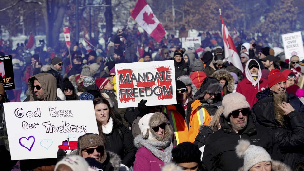 Demonstrators in support of a trucker convoy protesting against COVID-19 restrictions
