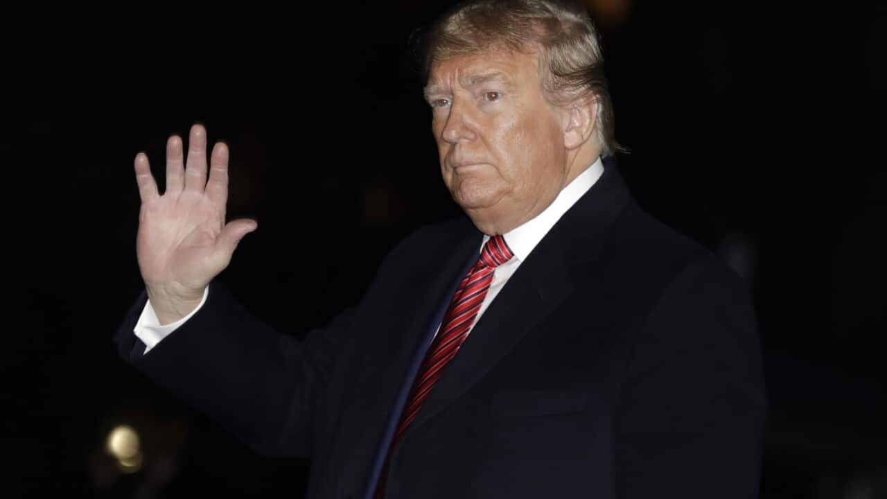 US President Donald Trump waves as he walks on the South Lawn of the White House upon his return to Washington from Florida on 16 February 2020.