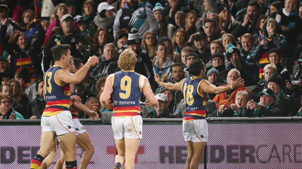 Adelaide Crows star Eddie Betts (R) celebrates after scoring a goal