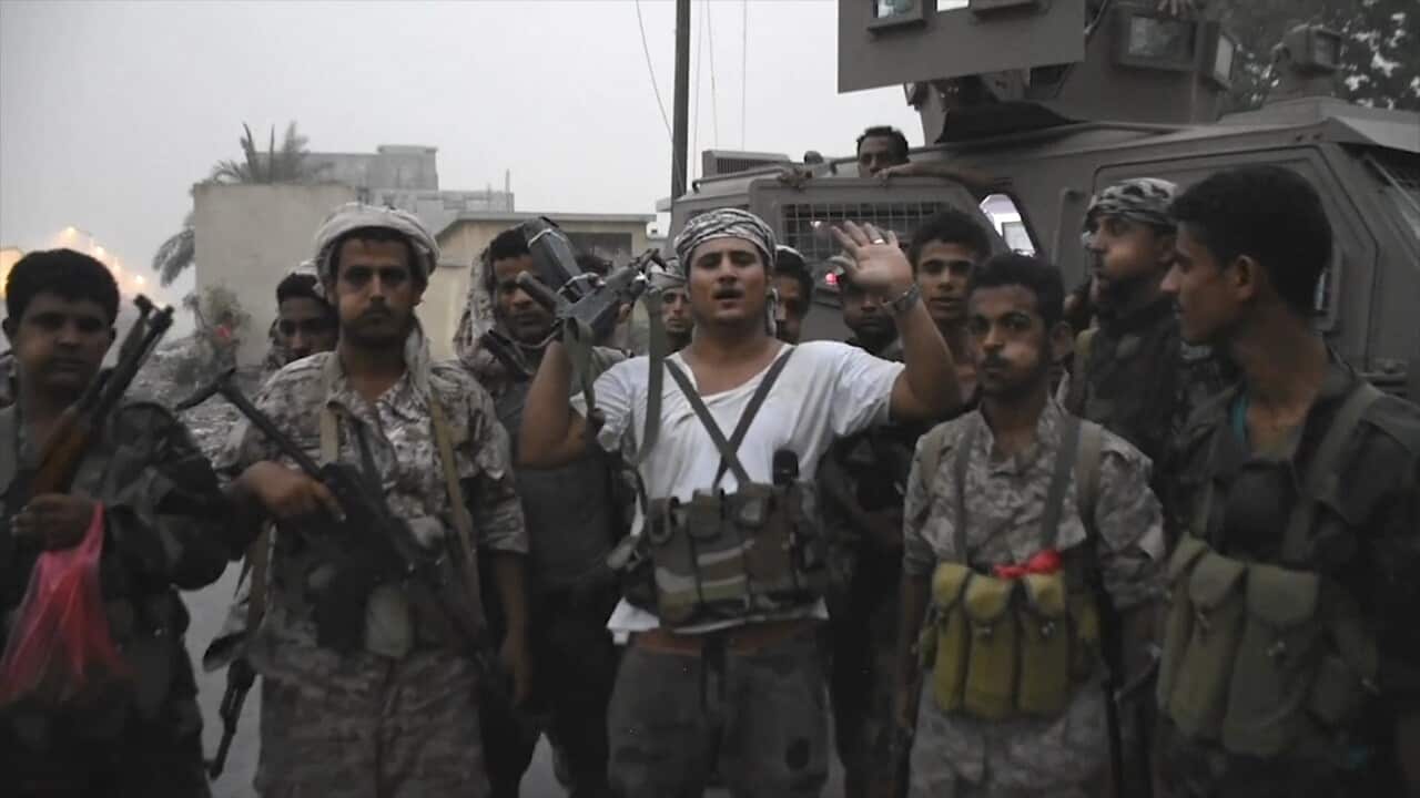 Separatist fighters line up before storming the presidential palace in the southern port city of Aden, Yemen.