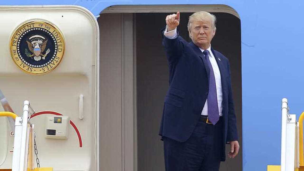 U.S. President Donald Trump boards Air Force One before departing from Noi Bai international airport, in Hanoi, Vietnam Sunday, Nov. 12, 2017.