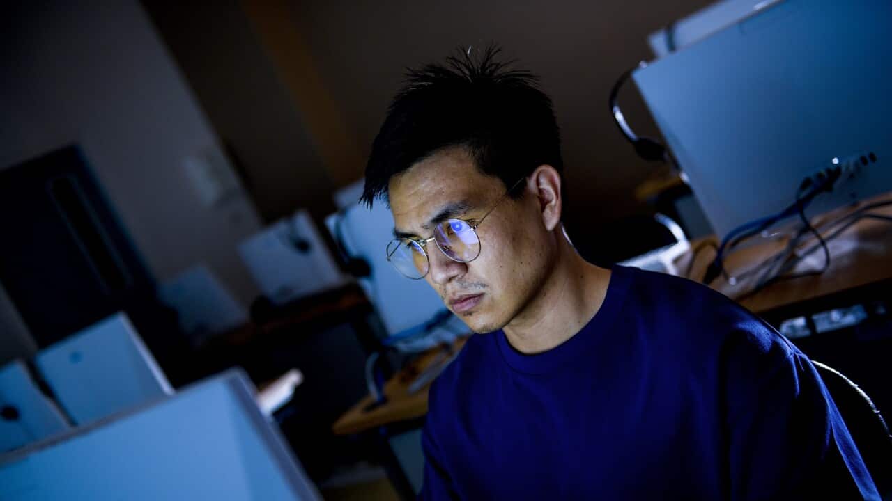 Computer hacker stealing information with computer