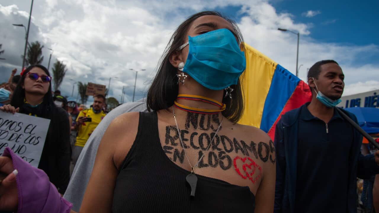 A demonstrator with the message "We remember our death in our hearts" in northern Bogota, Colombia.