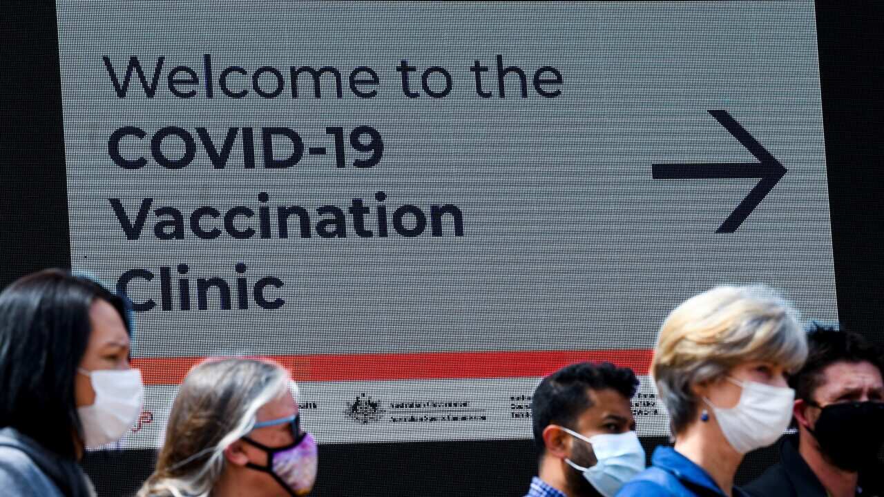 Residents at the COVID-19 vaccination clinic at the Australian Institute of Sport (AIS) in Canberra.