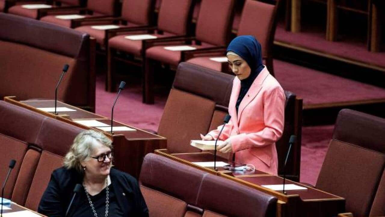 Newly-elected Labor Senator Fatima Payman (R), the first Afghan-Australian Muslim woman in Parliament, attends a session in the Senate chamber during the opening of the 47th Parliament at Parliament House in Canberra on July 26, 2022. (Photo by AFP) (Photo by STR/AFP via Getty Images).