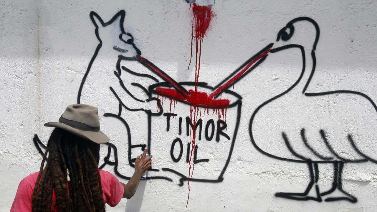 140303_east_timor_oil_graffiti_dili_aap.jpg