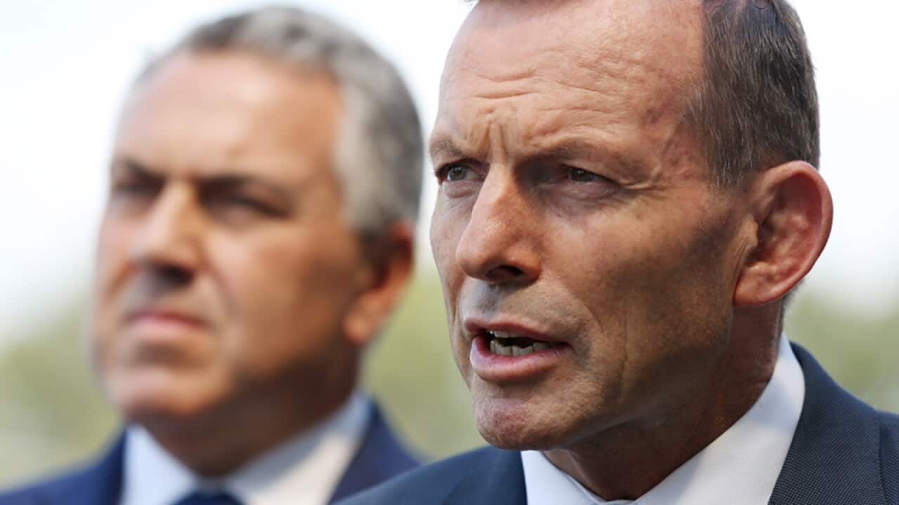 Prime Minister Tony Abbott (R) and Treasurer Joe Hockey