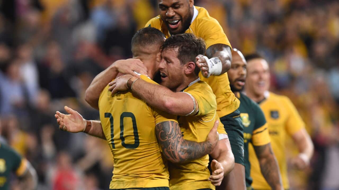 Wallabies player Bernard Foley (centre) celebrates