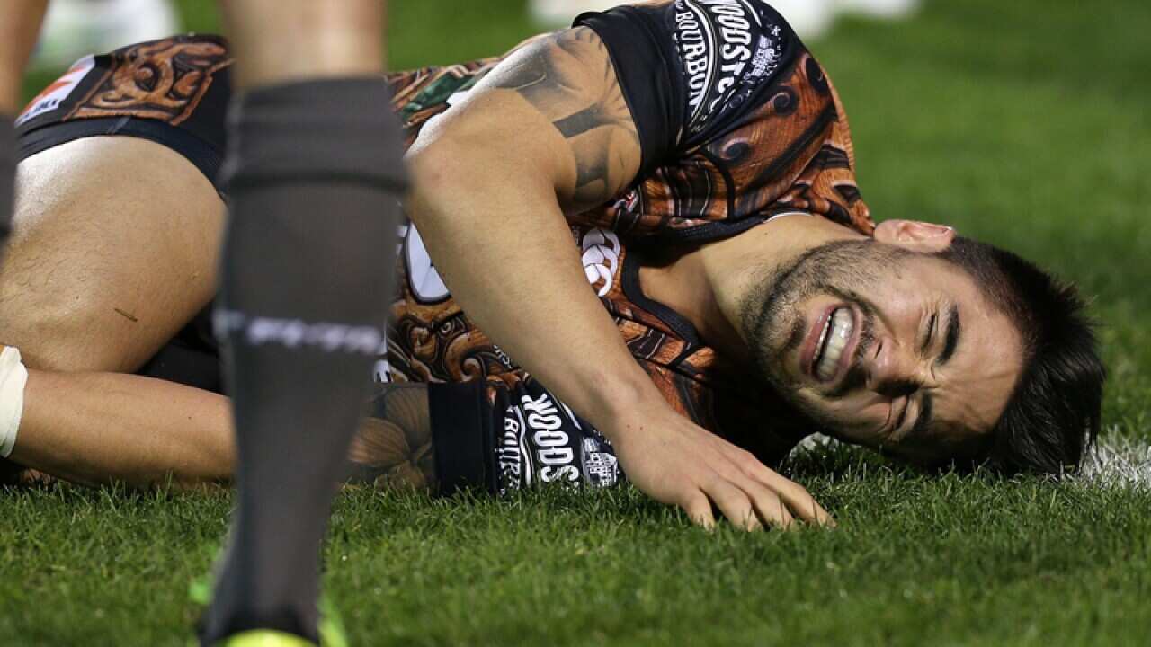 Shaun Johnson of the New Zealand Warriors lies injured