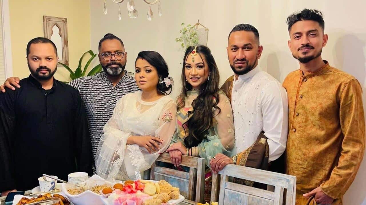 Jahan Asif (second from right) and wife Annie (third from right) celebrate Eid on Monday night with friends.