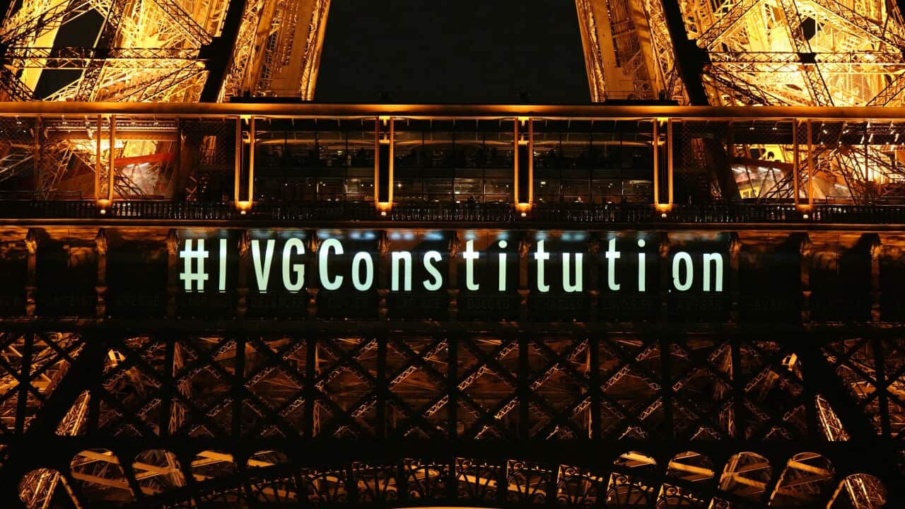 A message pertaining to abortion and the constitution is projected onto the Eiffel Tower