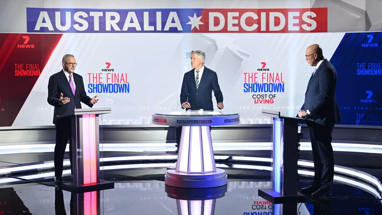 Anthony Albanese and Peter Dutton stand at podiums facing each other on a television debate stage.