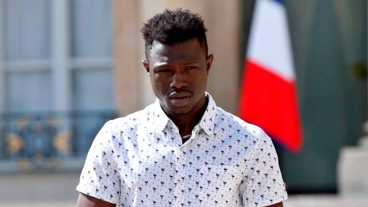 Mamoudou Gassama leaves the presidential Elysee Palace after meeting with the French President in Paris.